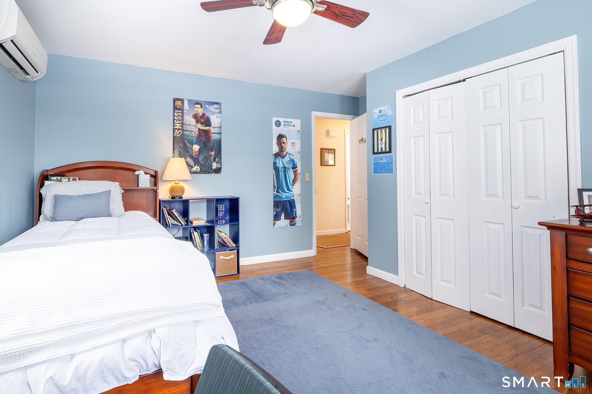 35 Highview Drive Ridgefield, CT 06877 - Photo 15 of 35 a bed room with a bed and a chandelier