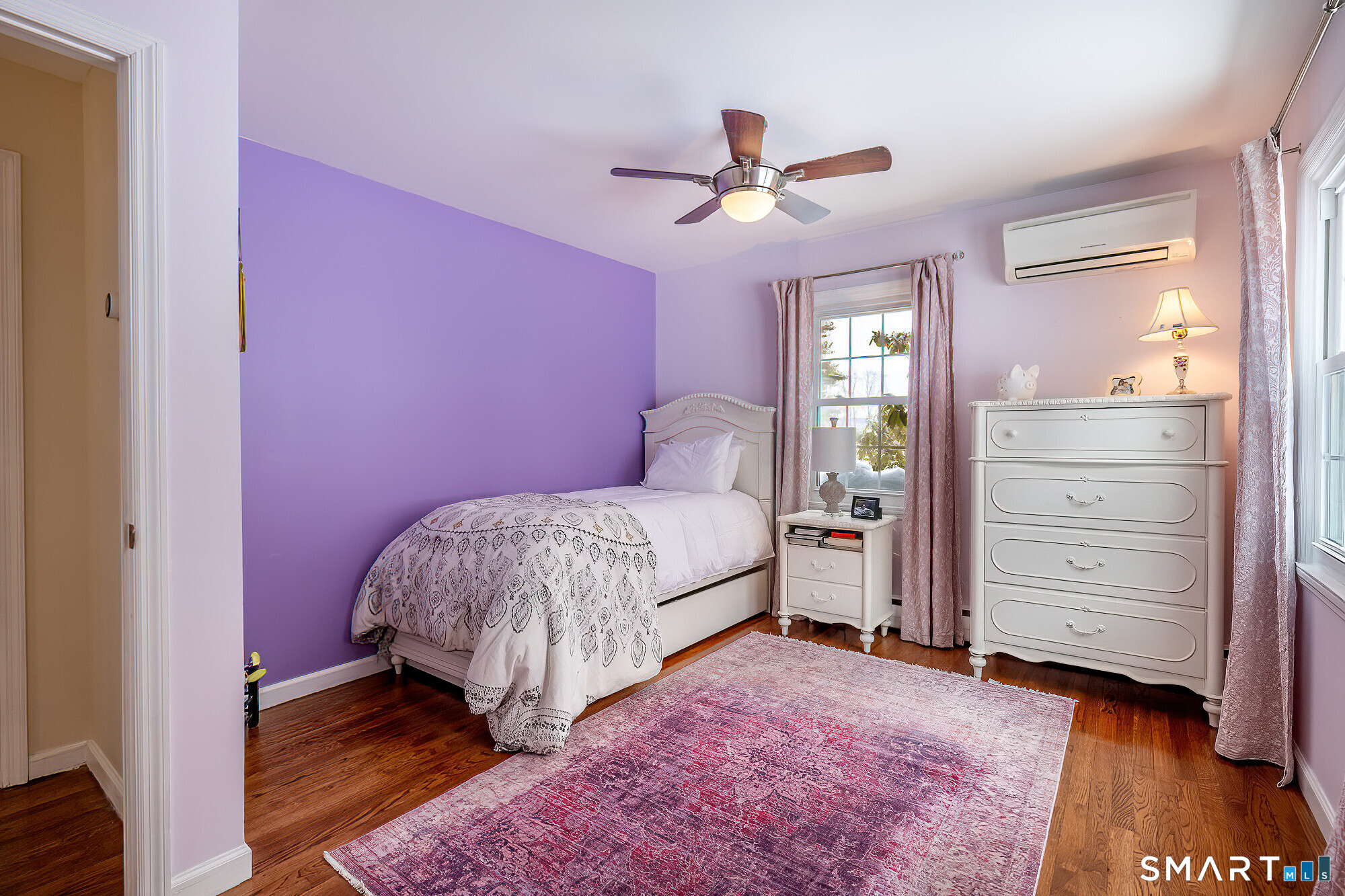 35 Highview Drive Ridgefield, CT 06877 - Photo 18 of 35 a bedroom with a bed and a chandelier