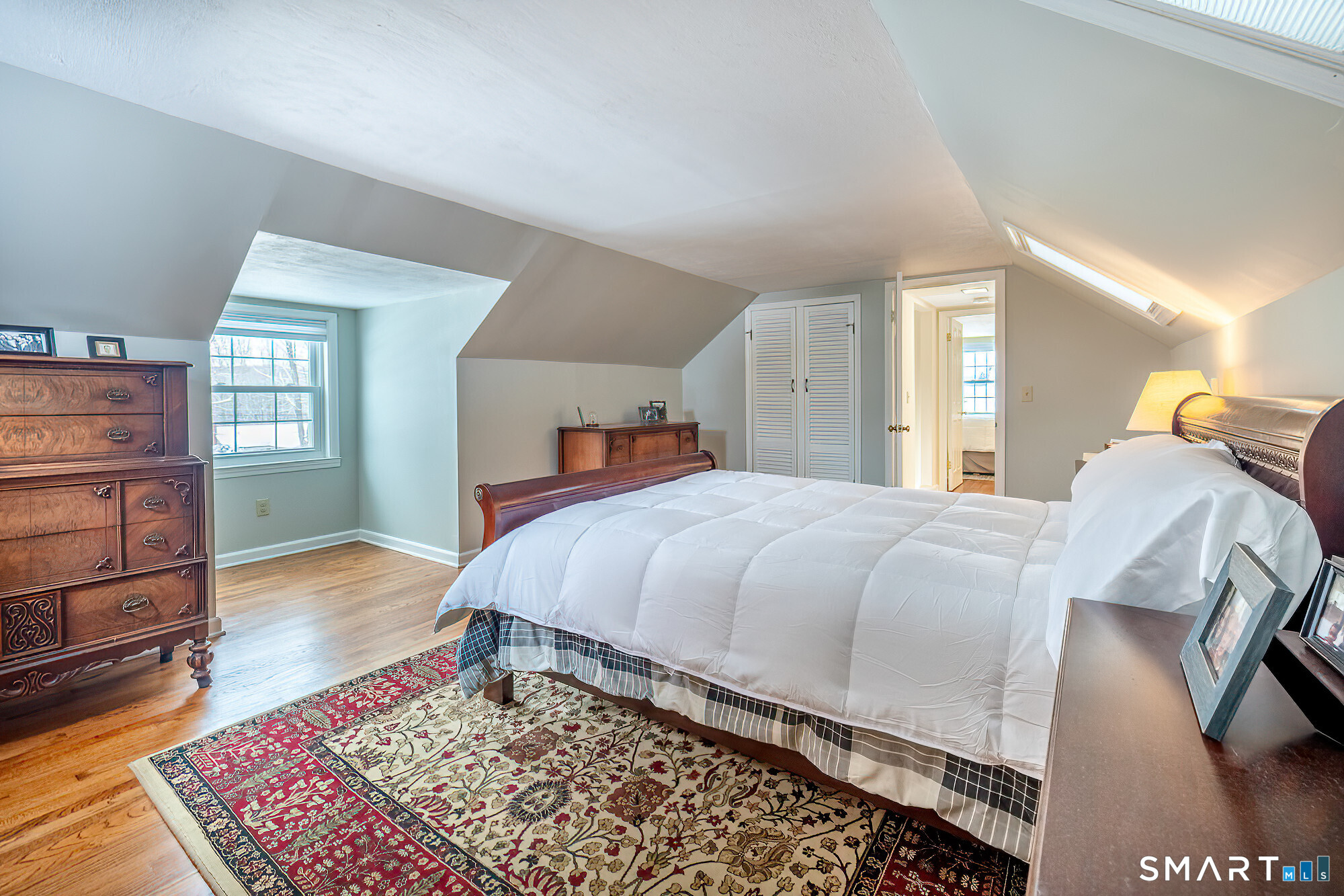 35 Highview Drive Ridgefield, CT 06877 - Photo 20 of 35 a bedroom with a bed and wooden floor