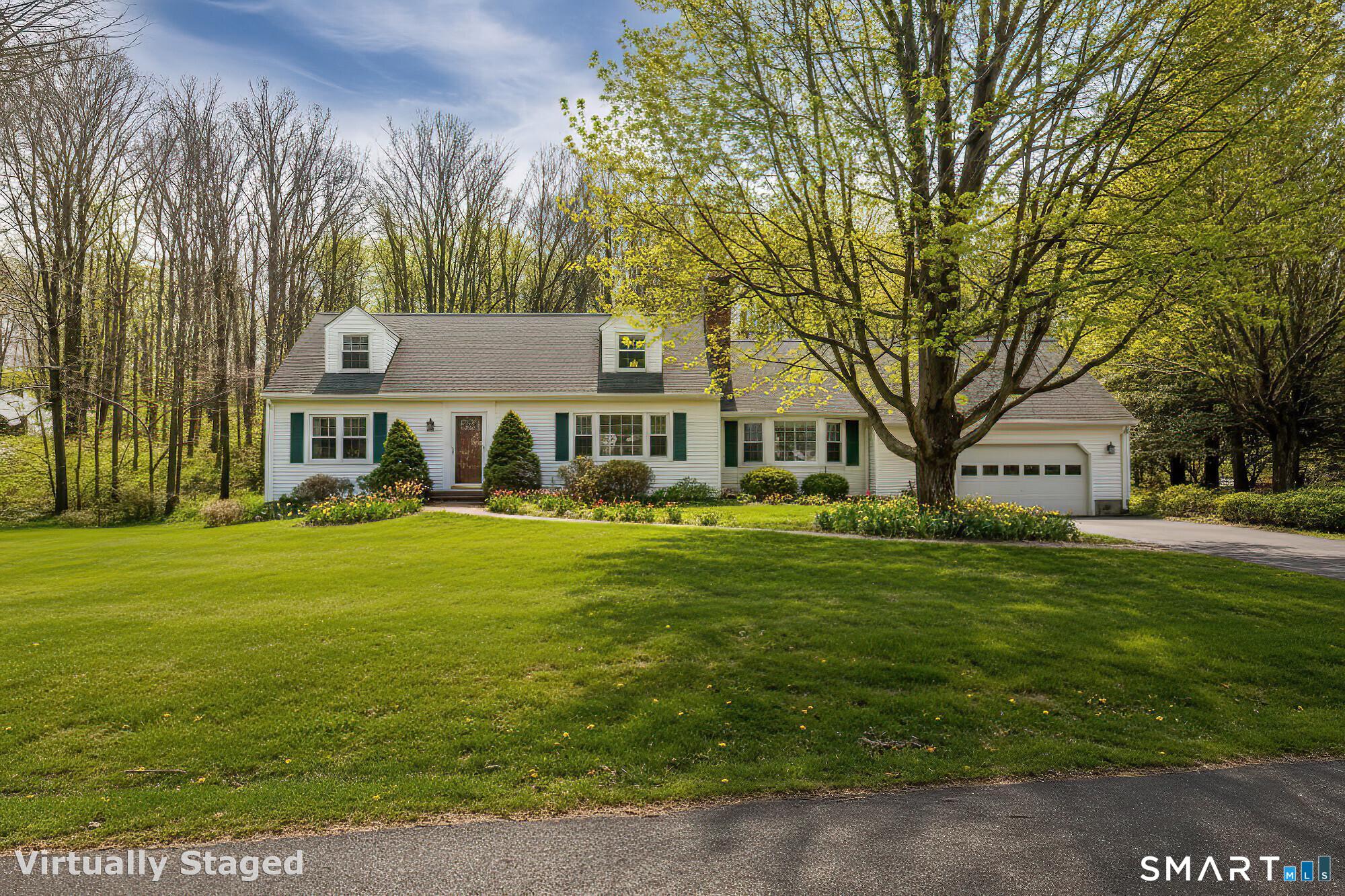 35 Highview Drive Ridgefield, CT 06877 - Photo 2 of 35 a front view of a house with a garden