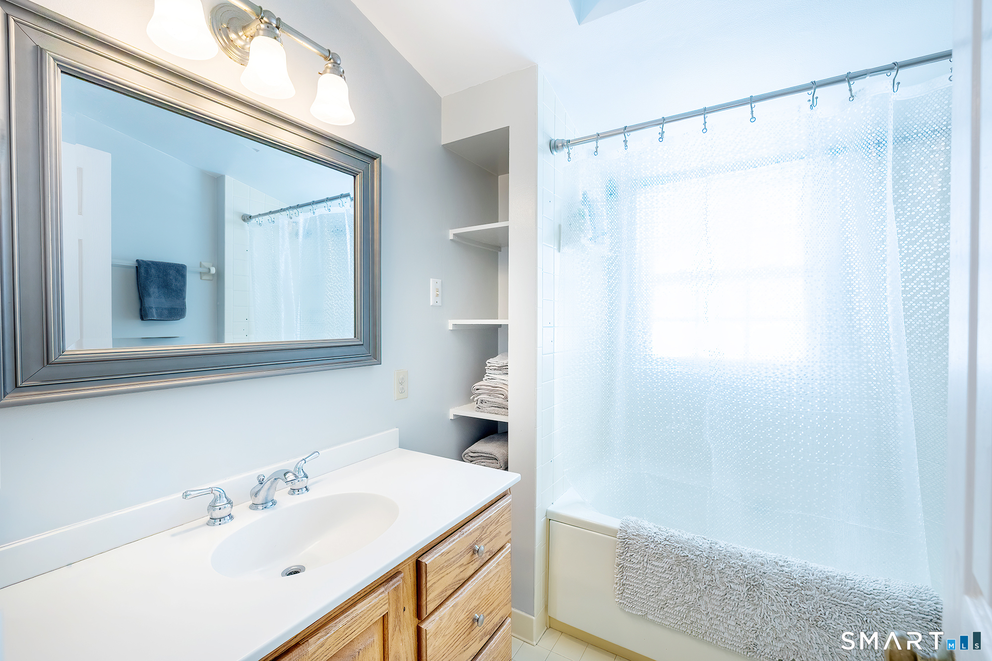 35 Highview Drive Ridgefield, CT 06877 - Photo 23 of 35 a bathroom with a sink and a mirror