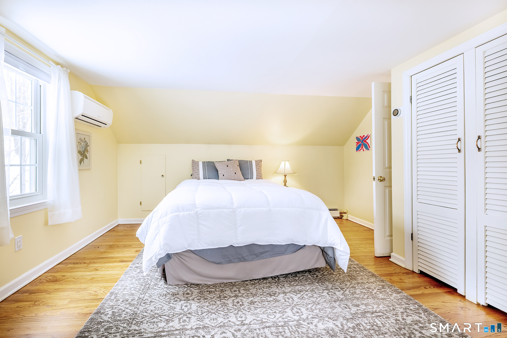 35 Highview Drive Ridgefield, CT 06877 - Photo 25 of 35 a spacious bedroom with a bed and wooden floor