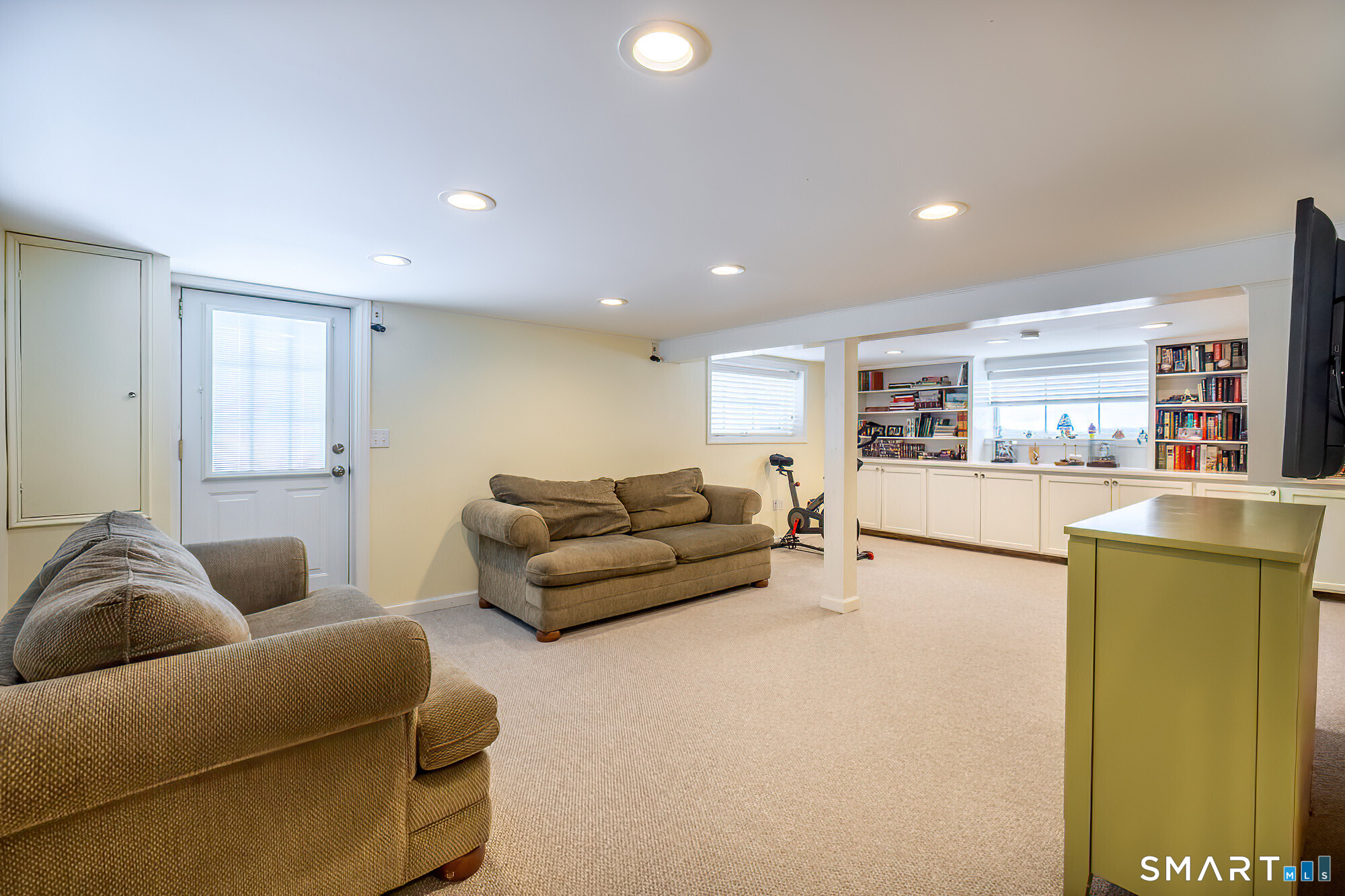 35 Highview Drive Ridgefield, CT 06877 - Photo 30 of 35 a living room with furniture and a kitchen view