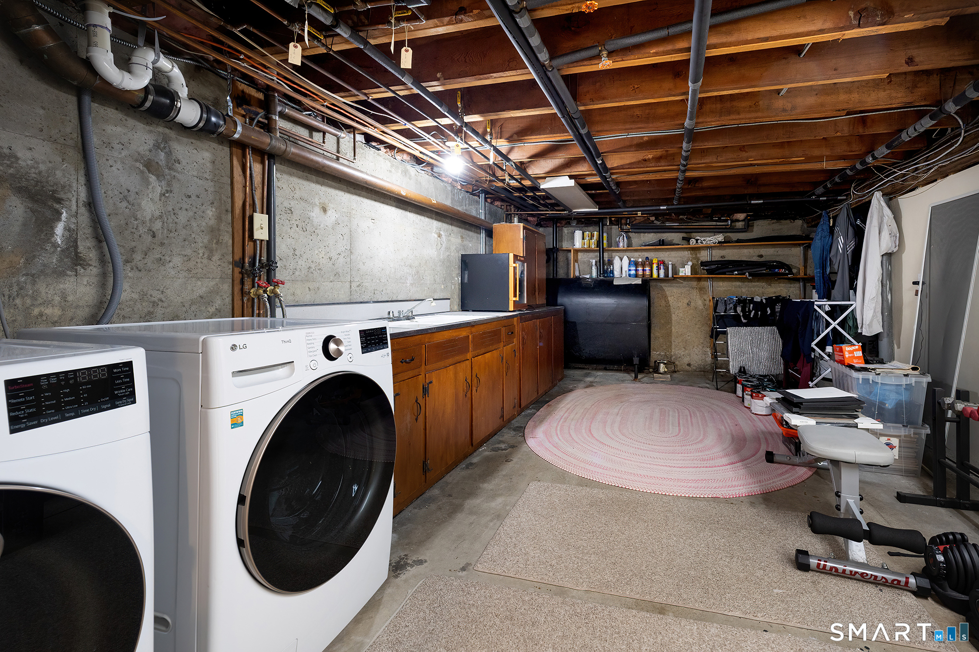 35 Highview Drive Ridgefield, CT 06877 - Photo 31 of 35 a view of a storage & utility room with washer and dryer