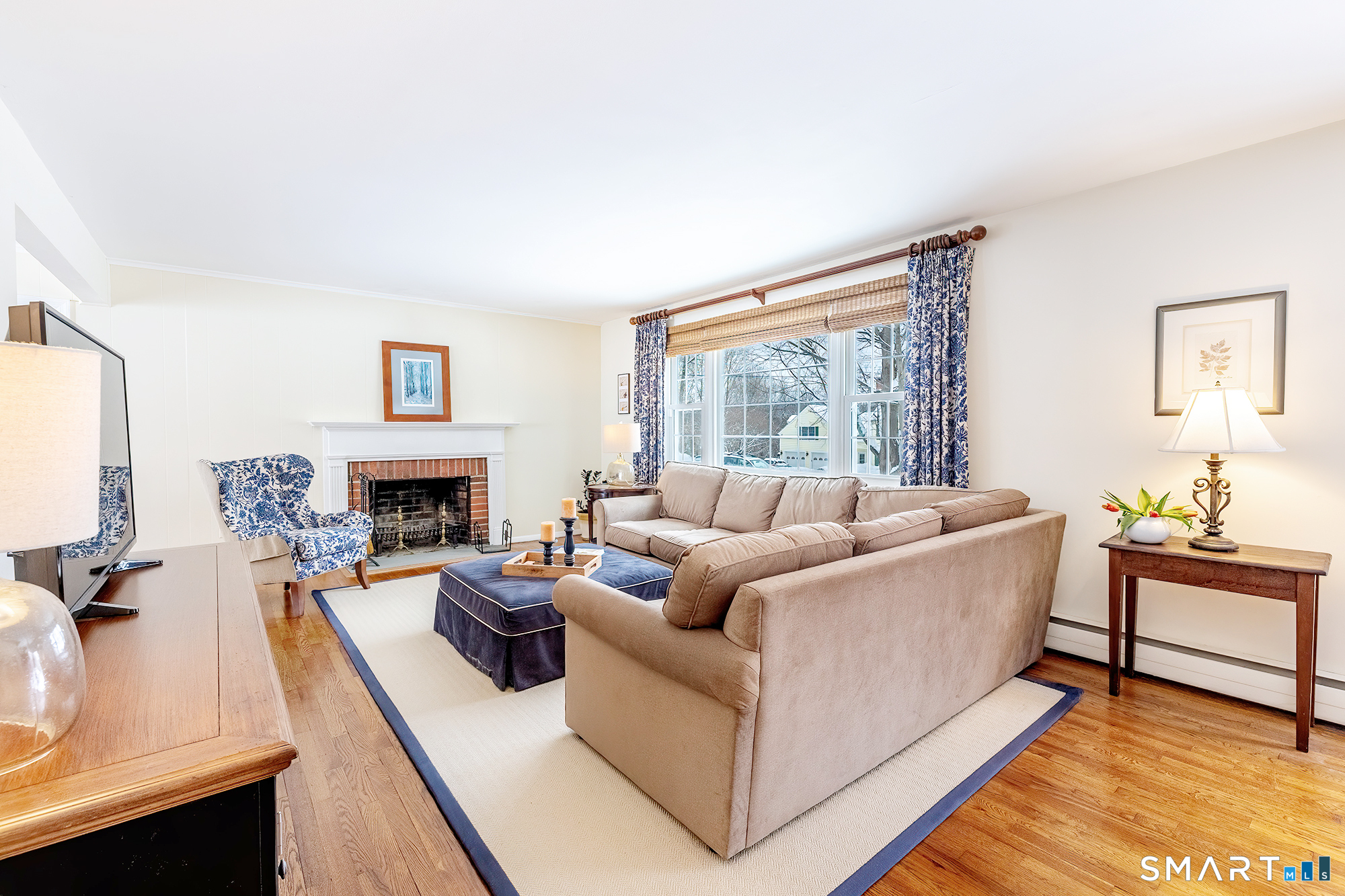 35 Highview Drive Ridgefield, CT 06877 - Photo 5 of 35 a living room with furniture and a fireplace