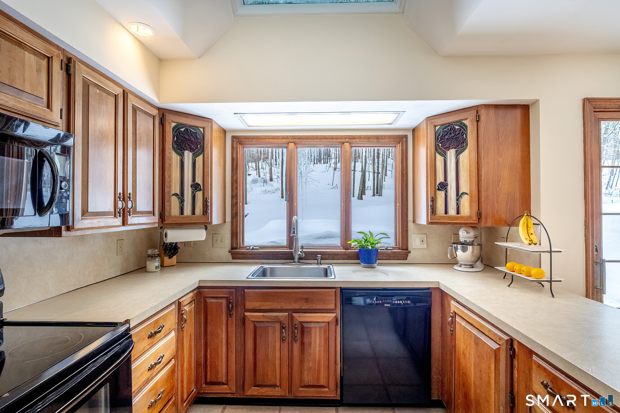 35 Highview Drive Ridgefield, CT 06877 - Photo 9 of 35 a kitchen with stainless steel appliances a sink and a window