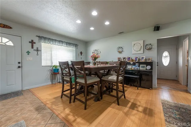 a kitchen with stainless steel appliances granite countertop sink stove top oven and cabinets