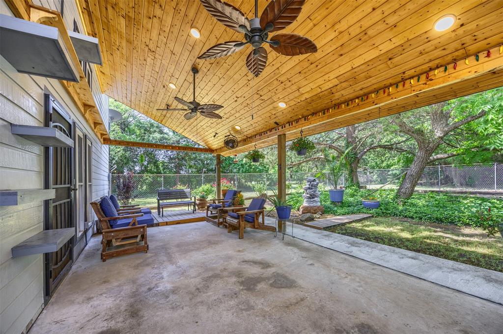 881 Wild Road Van Alstyne, TX 75495 - Photo 27 of 40 a view of chairs and tables in the patio