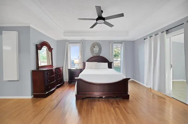 a living room with a bed furniture and a window