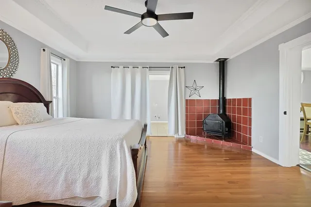 a spacious bedroom with a bed and a window