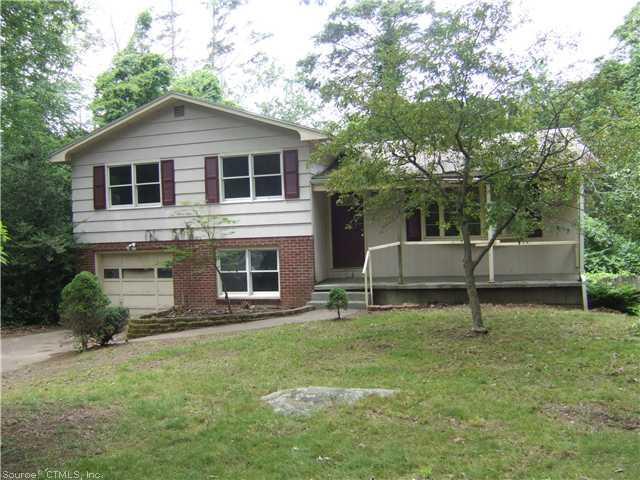 7 Hemlock Circle Ledyard, CT 06335 - Photo 1 of 1 a house that has a tree in front of it