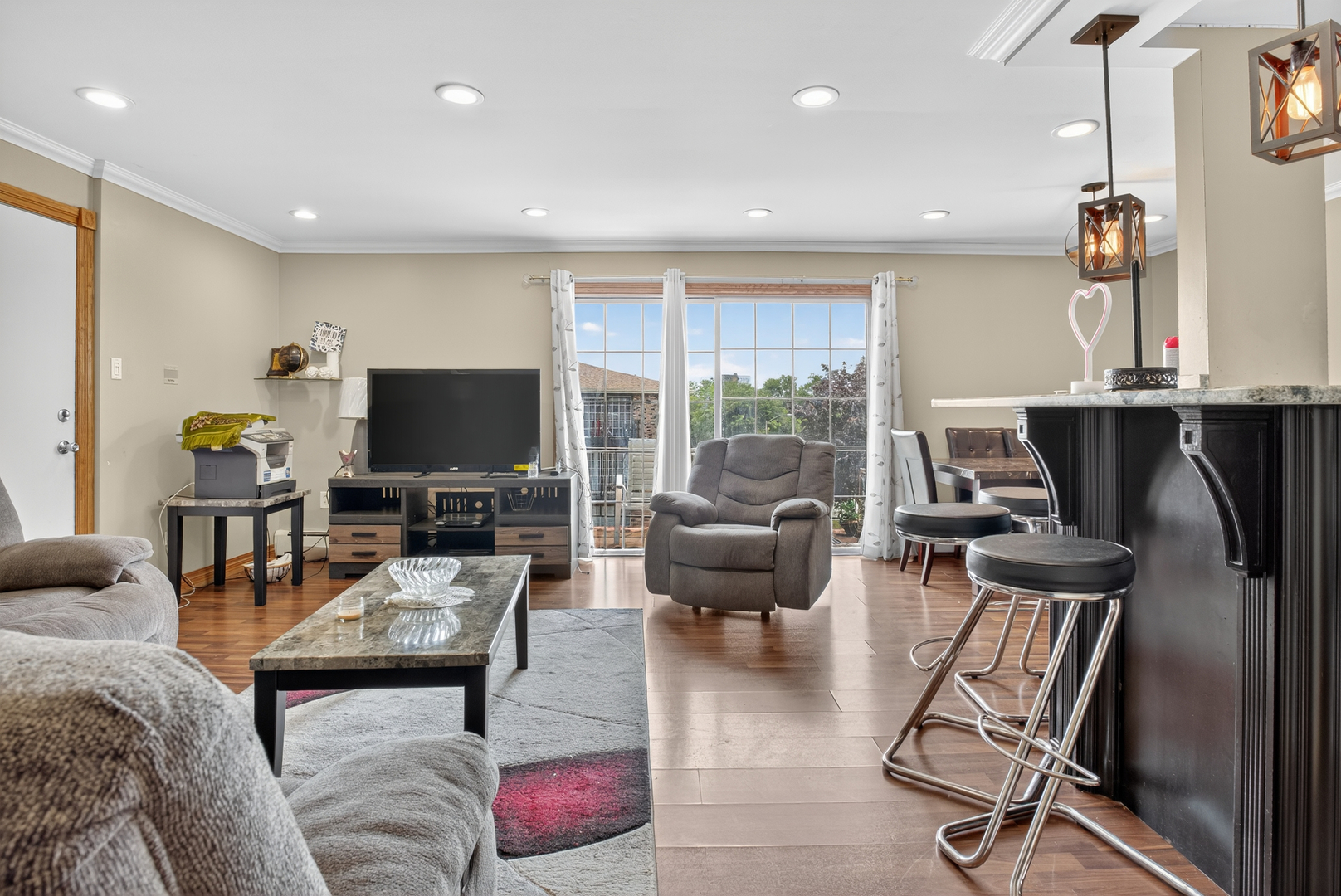7048 O'Connell Drive, Unit 3W Chicago Ridge, IL 60415 - Photo 2 of 22 a living room with furniture and a flat screen tv