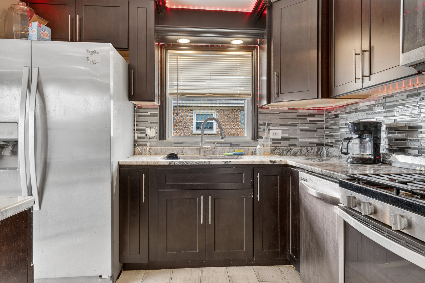 7048 O'Connell Drive, Unit 3W Chicago Ridge, IL 60415 - Photo 4 of 22 a kitchen with stainless steel appliances granite countertop a refrigerator and a sink