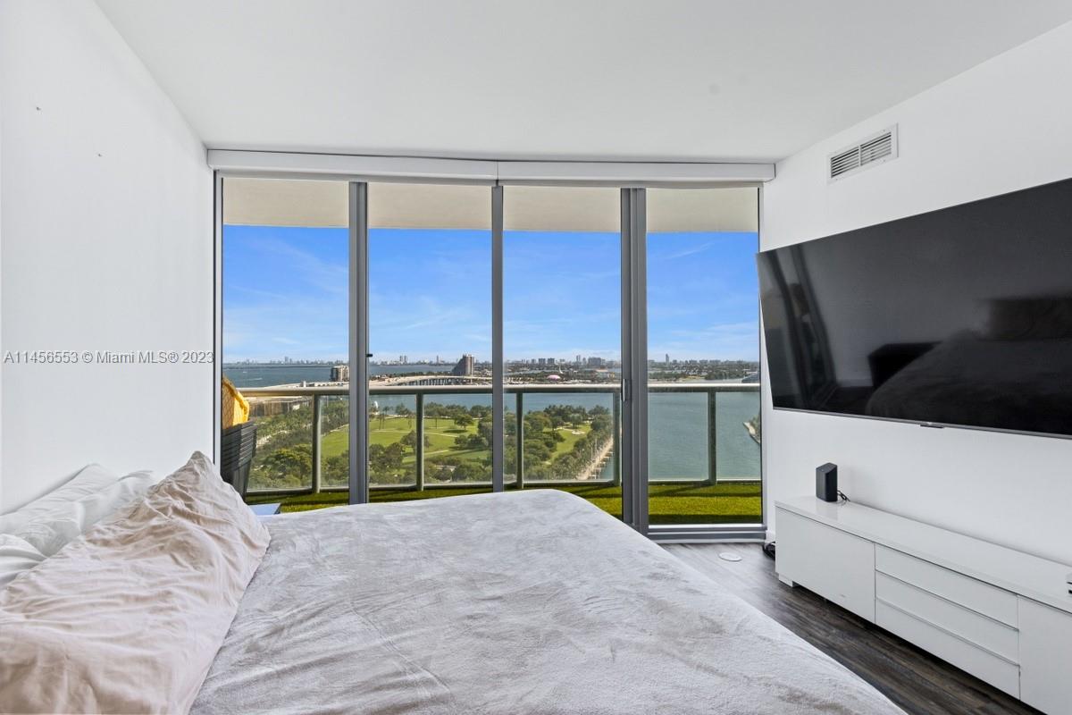 888 Biscayne Boulevard, Unit 1809 Miami, FL 33132 - Photo 14 of 37 a view of a living room and a flat screen tv