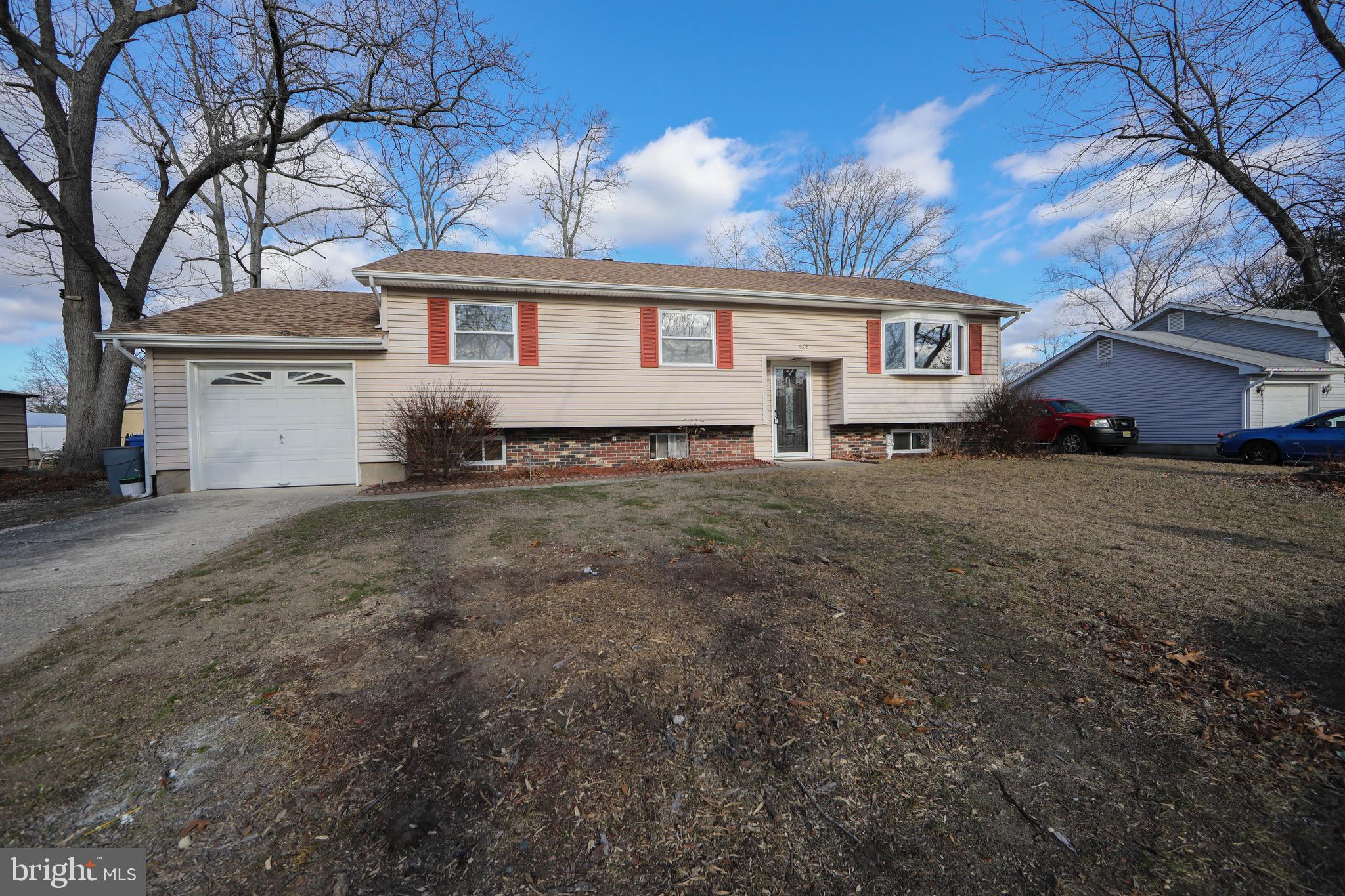 608 Katherine Road Browns Mills, NJ 08015 - Photo 40 of 42 a front view of a house with a garden