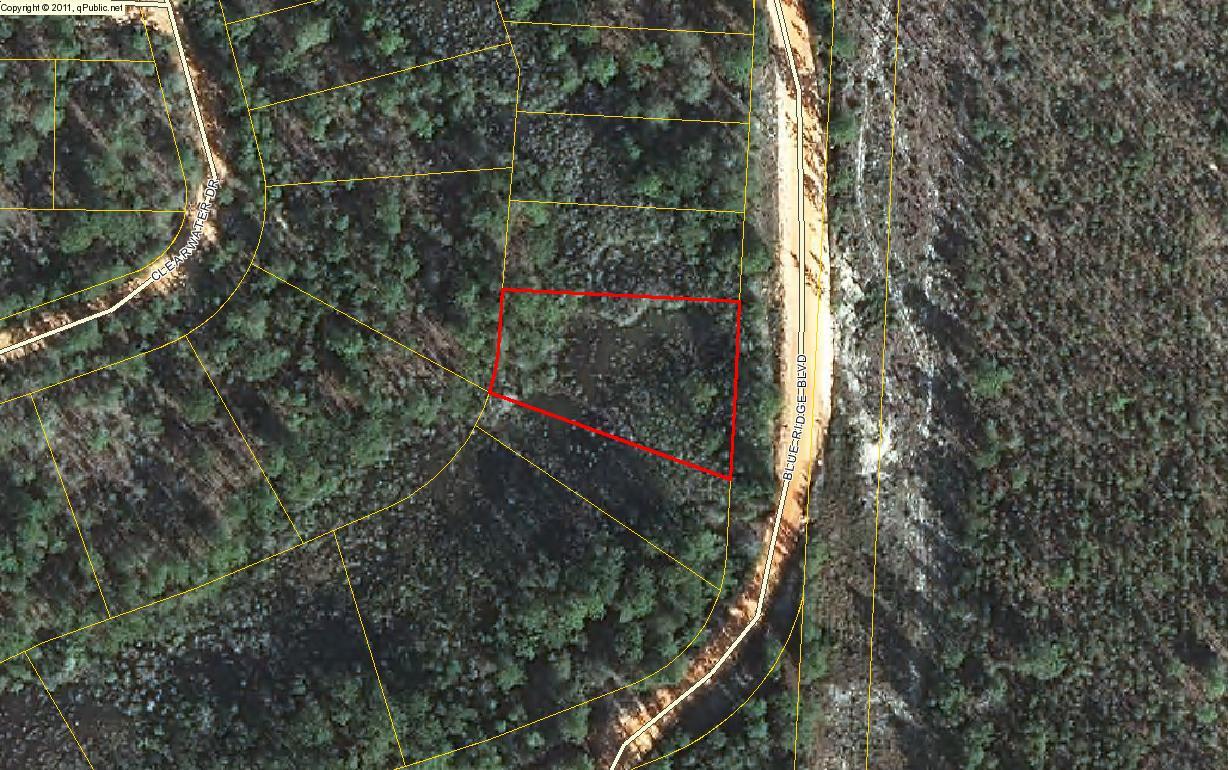Lot68-blk68 Blue Ridge Boulevard DeFuniak Springs, FL 32433 - Photo 2 of 6 a view of a wooden house and a yard