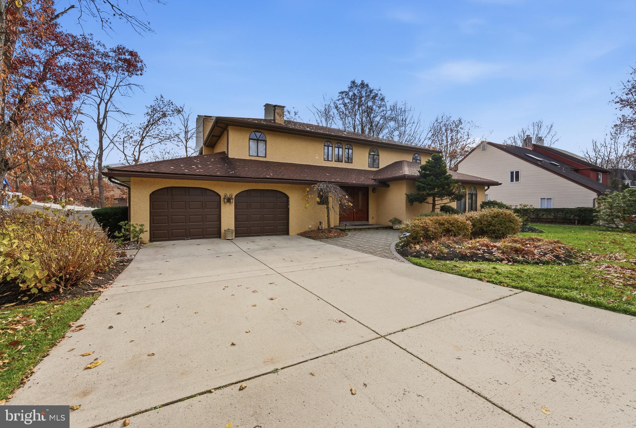 3 Stonehurst Drive Voorhees, NJ 08043 - Photo 2 of 43 a front view of a house with a garden