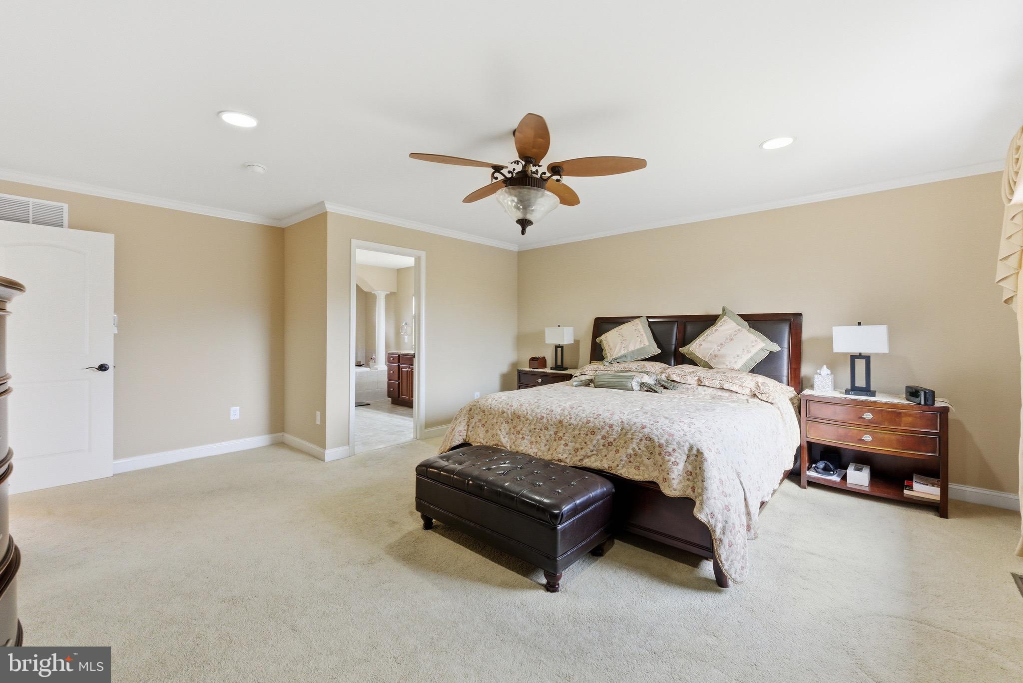 3 Stonehurst Drive Voorhees, NJ 08043 - Photo 21 of 43 a spacious bedroom with a bed and a chandelier