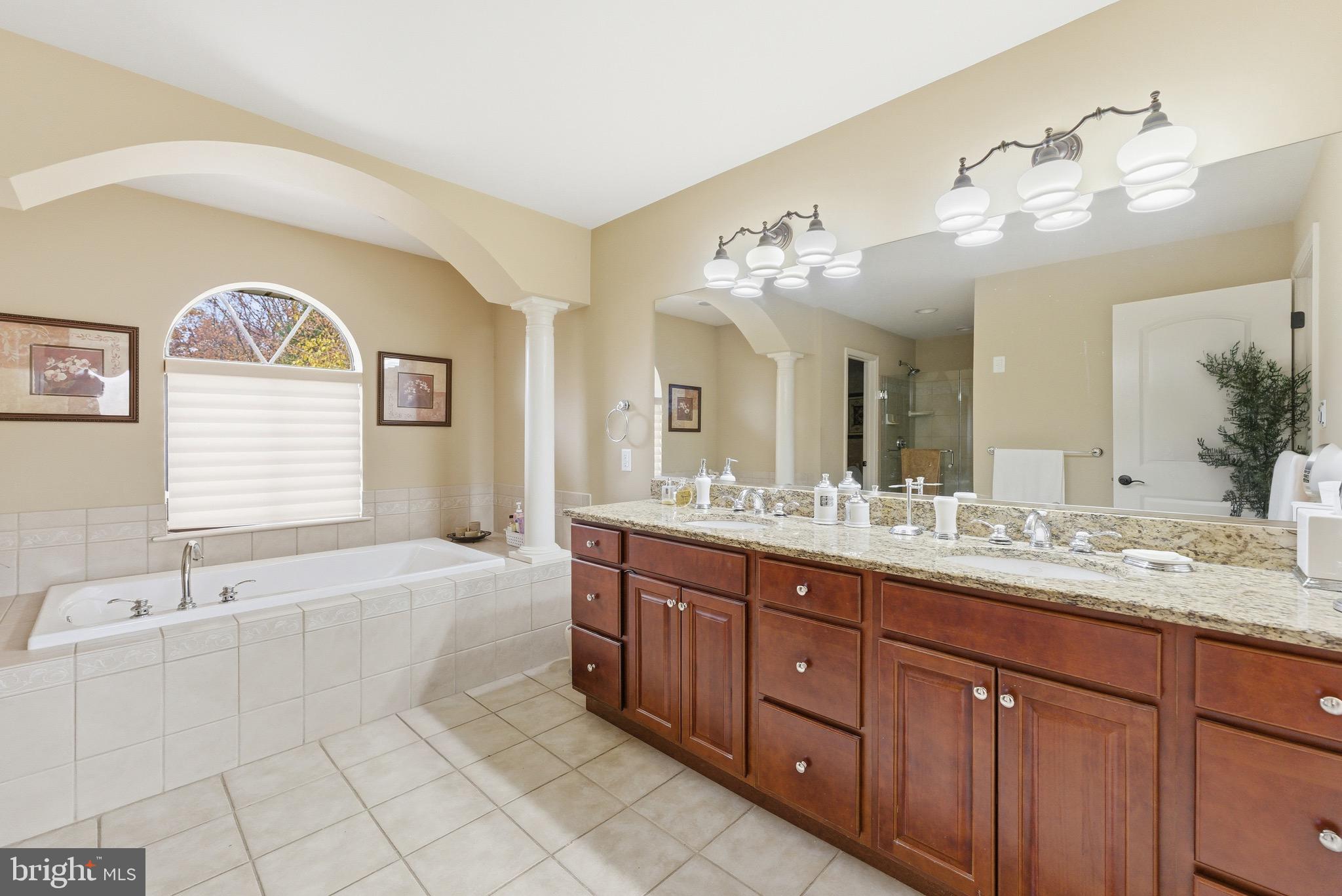 3 Stonehurst Drive Voorhees, NJ 08043 - Photo 22 of 43 a spacious bathroom with a granite countertop double vanity sink a mirror and a bathtub