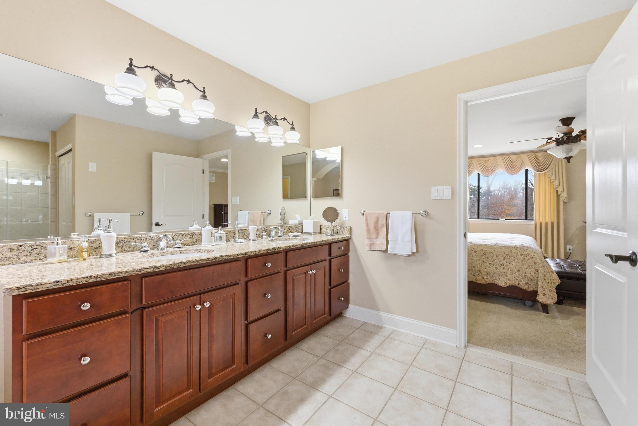 3 Stonehurst Drive Voorhees, NJ 08043 - Photo 24 of 43 a spacious en suite bathroom with a granite countertop sink mirror and bathtub