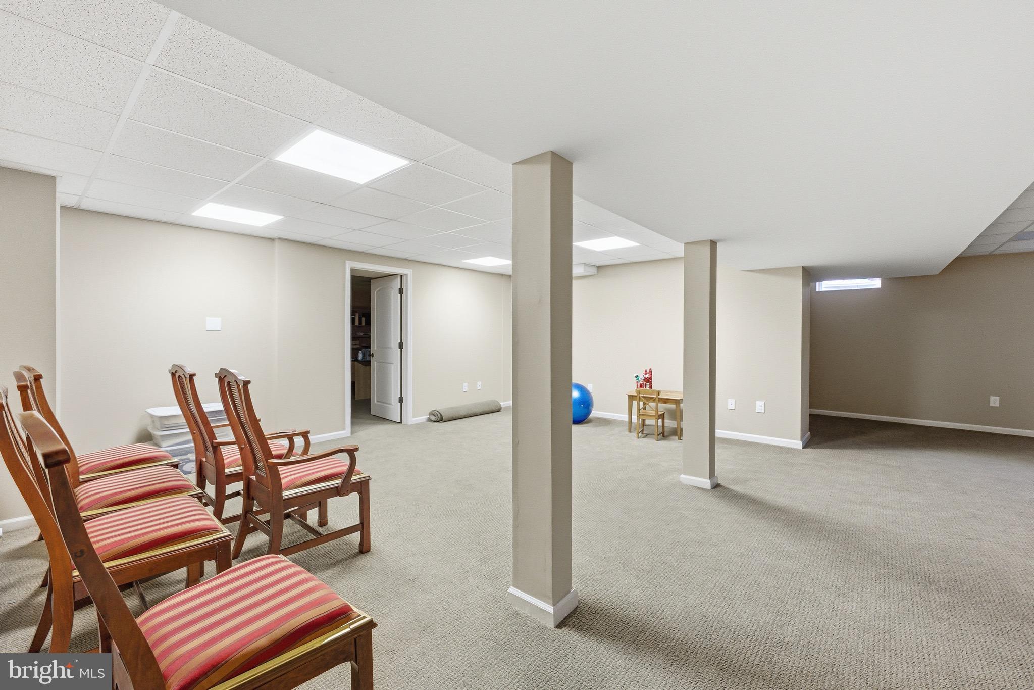 3 Stonehurst Drive Voorhees, NJ 08043 - Photo 30 of 43 a view of a hallway with chairs and table in a room