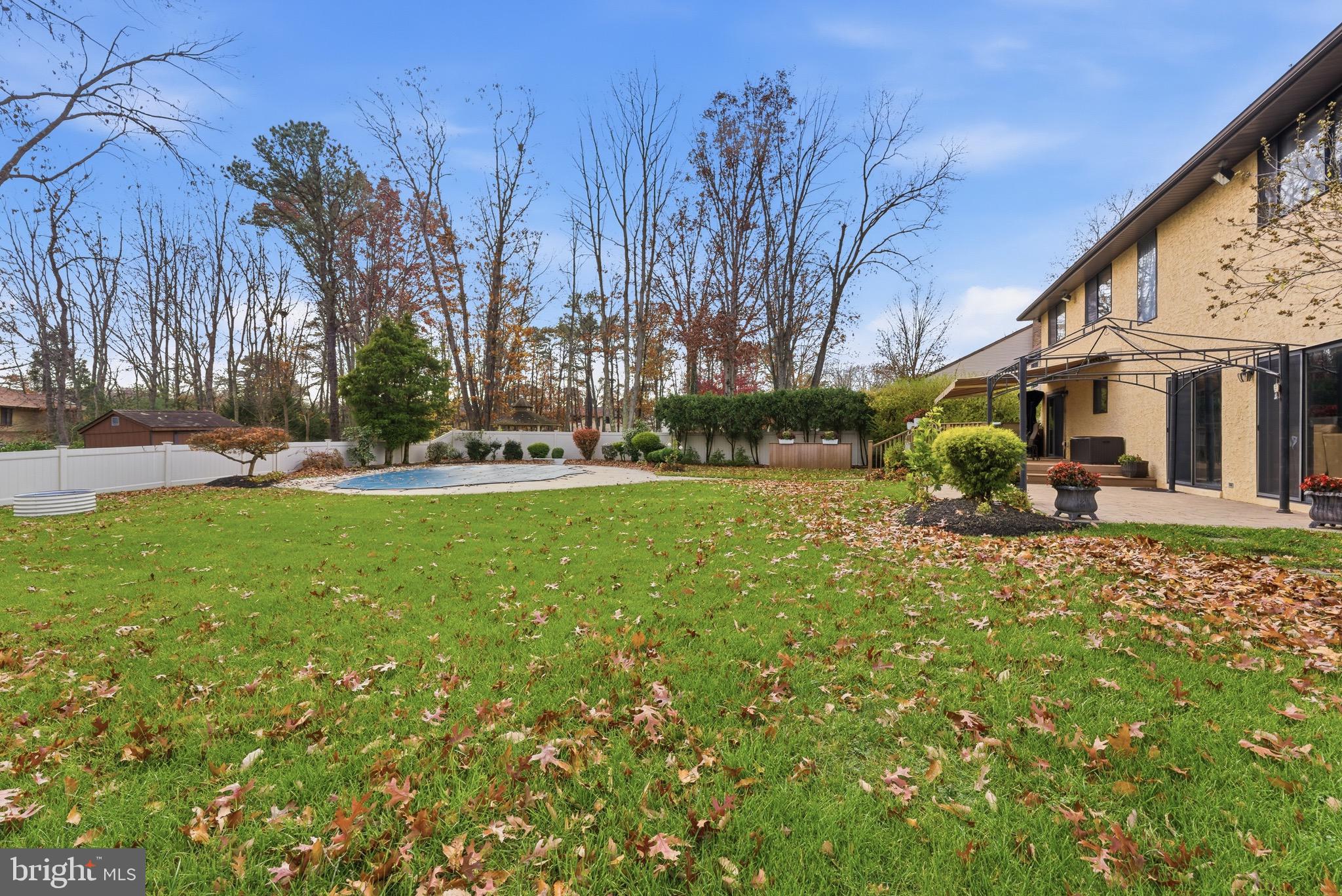 3 Stonehurst Drive Voorhees, NJ 08043 - Photo 40 of 43 a backyard of a house with table and chairs