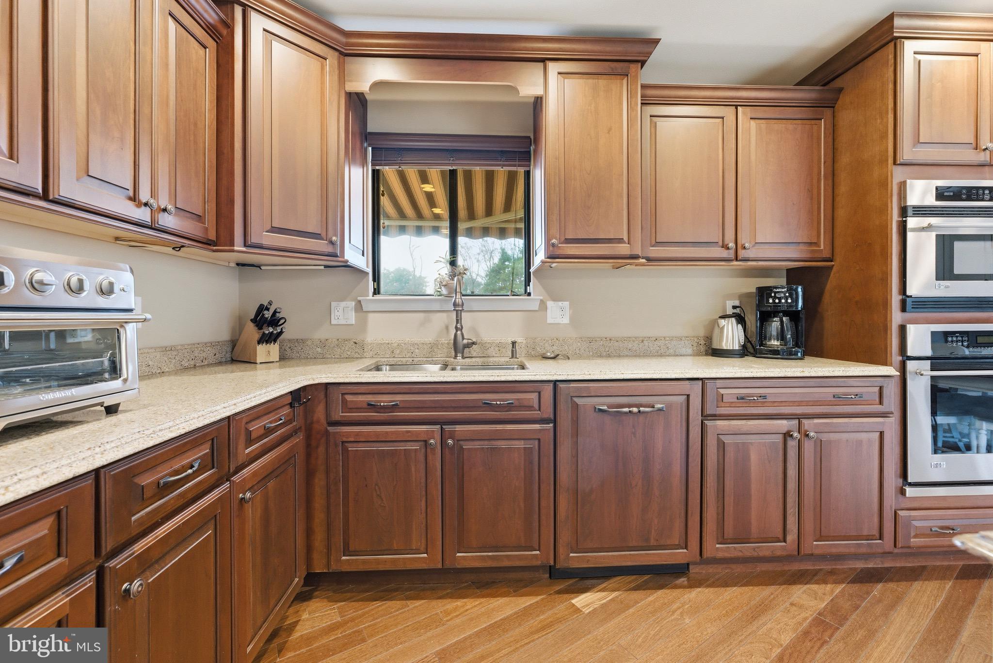 3 Stonehurst Drive Voorhees, NJ 08043 - Photo 6 of 43 a kitchen with stainless steel appliances granite countertop a sink dishwasher stove and cabinets