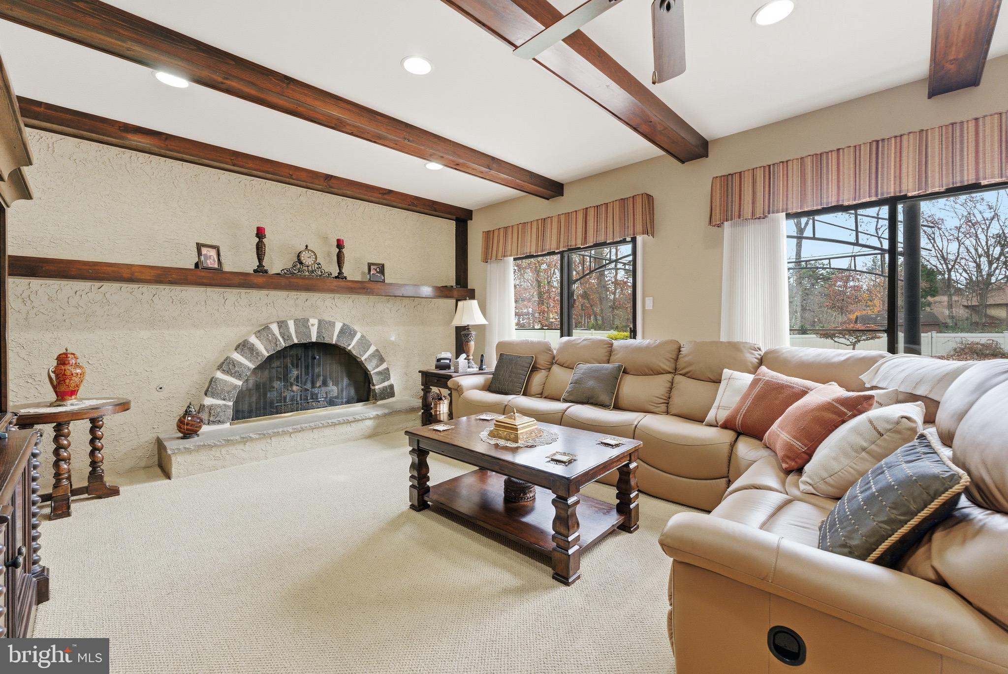 3 Stonehurst Drive Voorhees, NJ 08043 - Photo 9 of 43 a living room with furniture and a fireplace