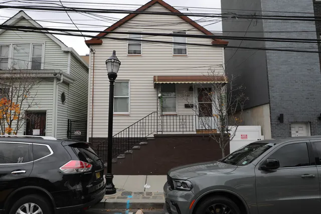 a view of a car park in front of house