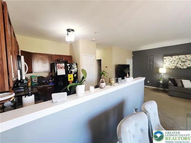 a room with furniture and a flat screen tv