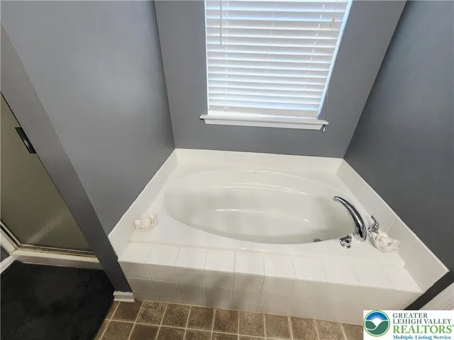 a bathroom with a bathtub