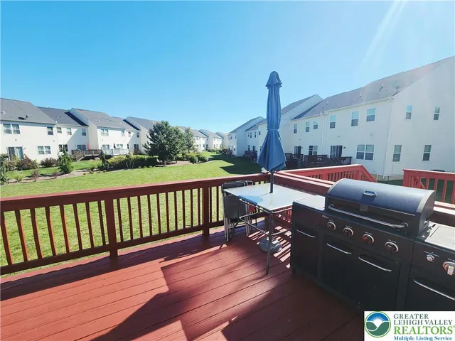 a balcony with furniture and wooden floor