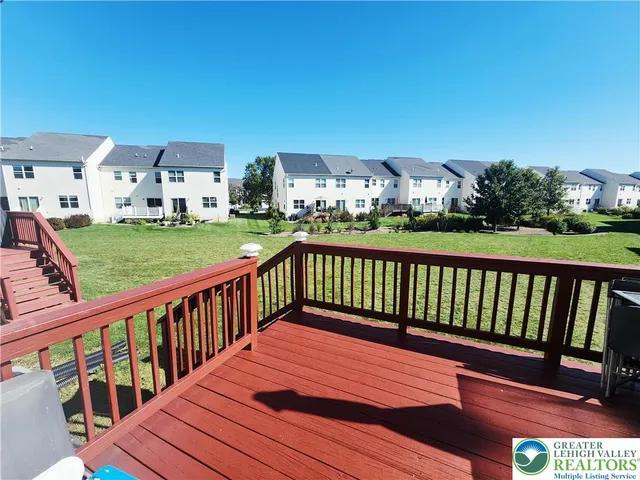 a view of a balcony with two chairs