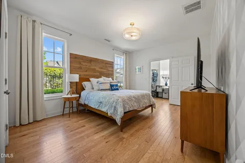 a kitchen with a sink cabinets stainless steel appliances and a window