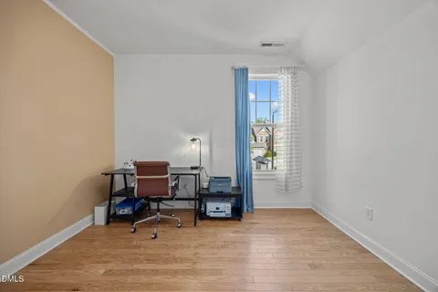 a view of a livingroom with furniture and a window