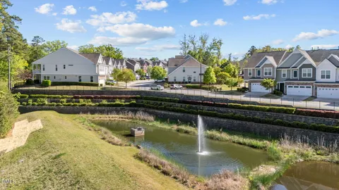 a view of backyard of house with green space