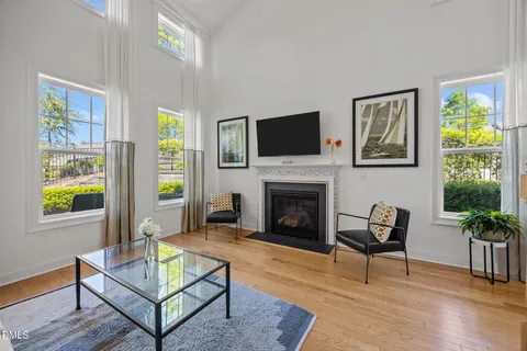 a living room with furniture rug and a fireplace