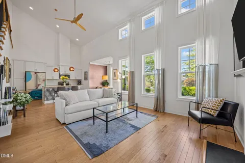 a living room with furniture a rug and a fireplace
