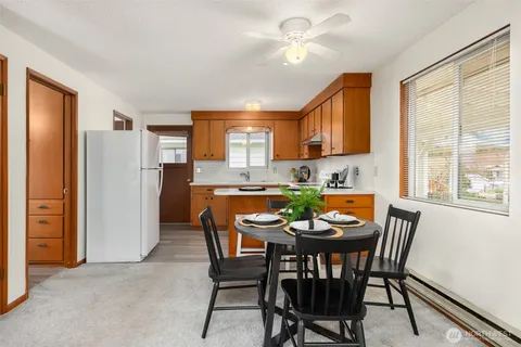 a dining room with furniture and window