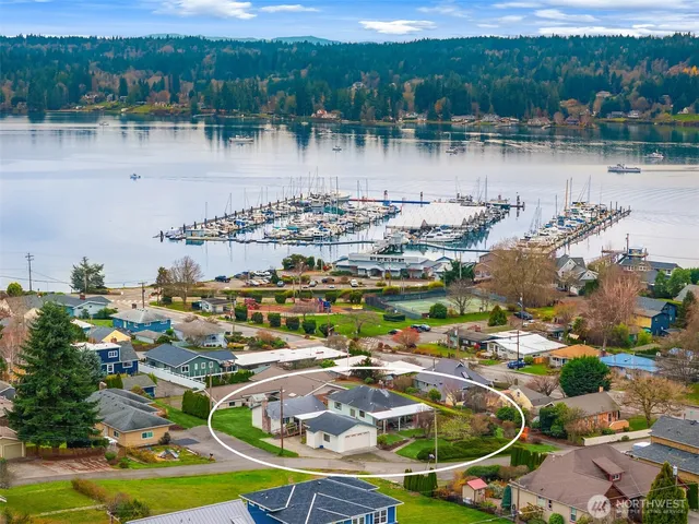 an aerial view of residential building with outdoor space and lake view