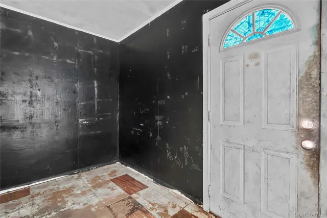 a bathroom with a glass shower door