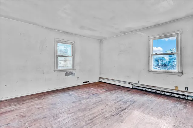 a view of a livingroom with an empty space and window