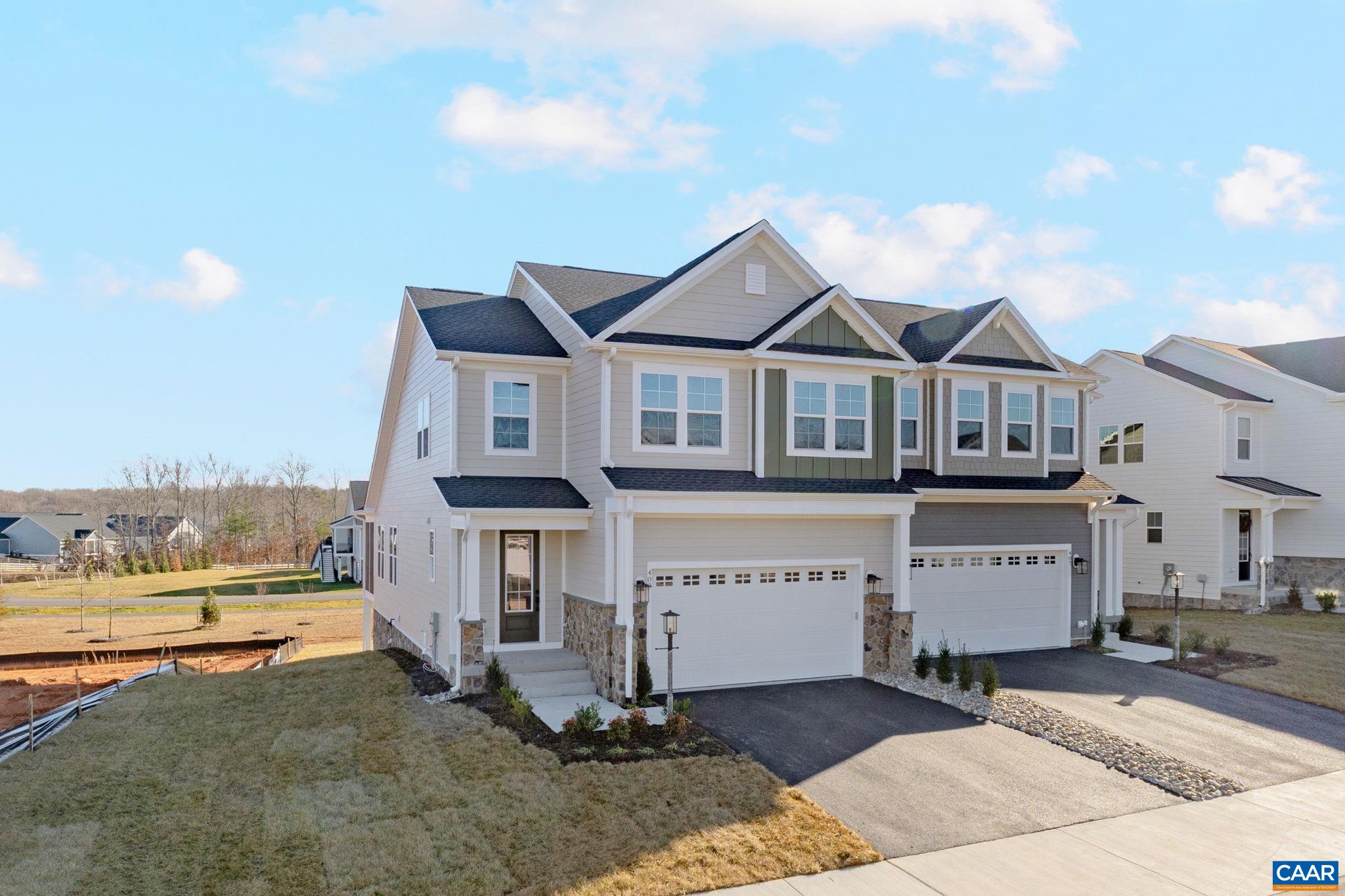 200 Marcella Street Charlottesville, VA 22911 - Photo 1 of 57 a view of a white house with a large windows and a small yard