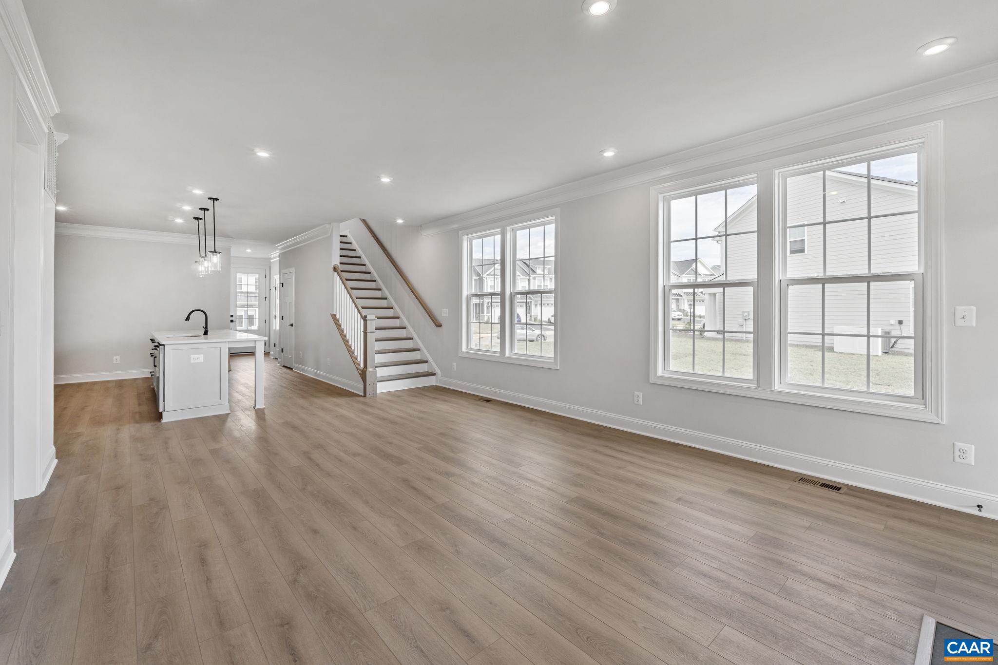 200 Marcella Street Charlottesville, VA 22911 - Photo 17 of 57 an empty room with wooden floor and windows