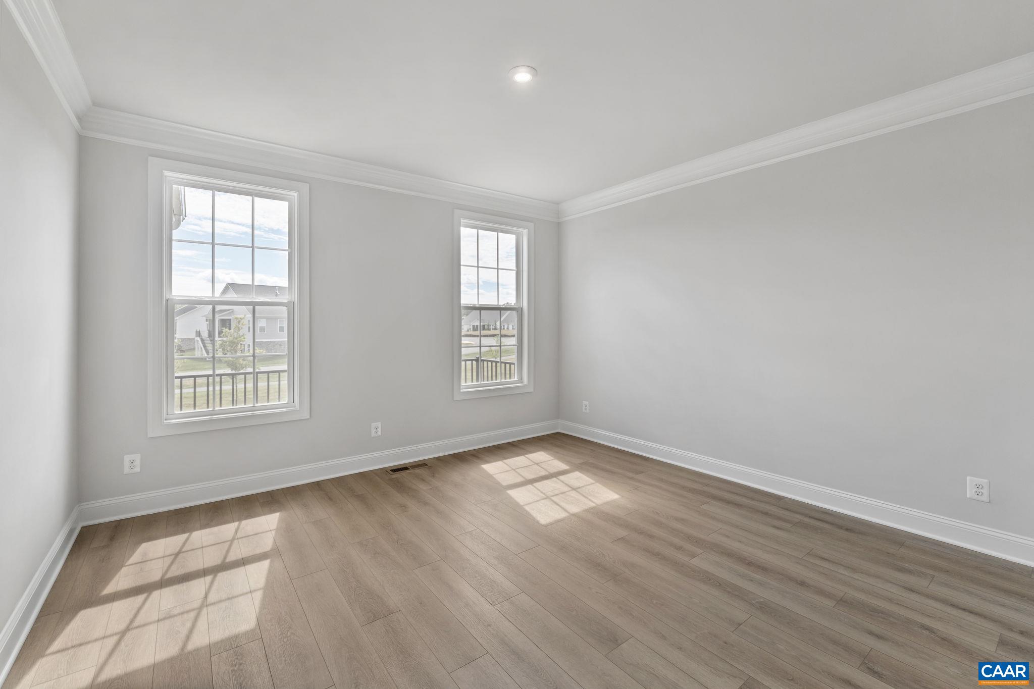 200 Marcella Street Charlottesville, VA 22911 - Photo 18 of 57 a view of an empty room with wooden floor and a window