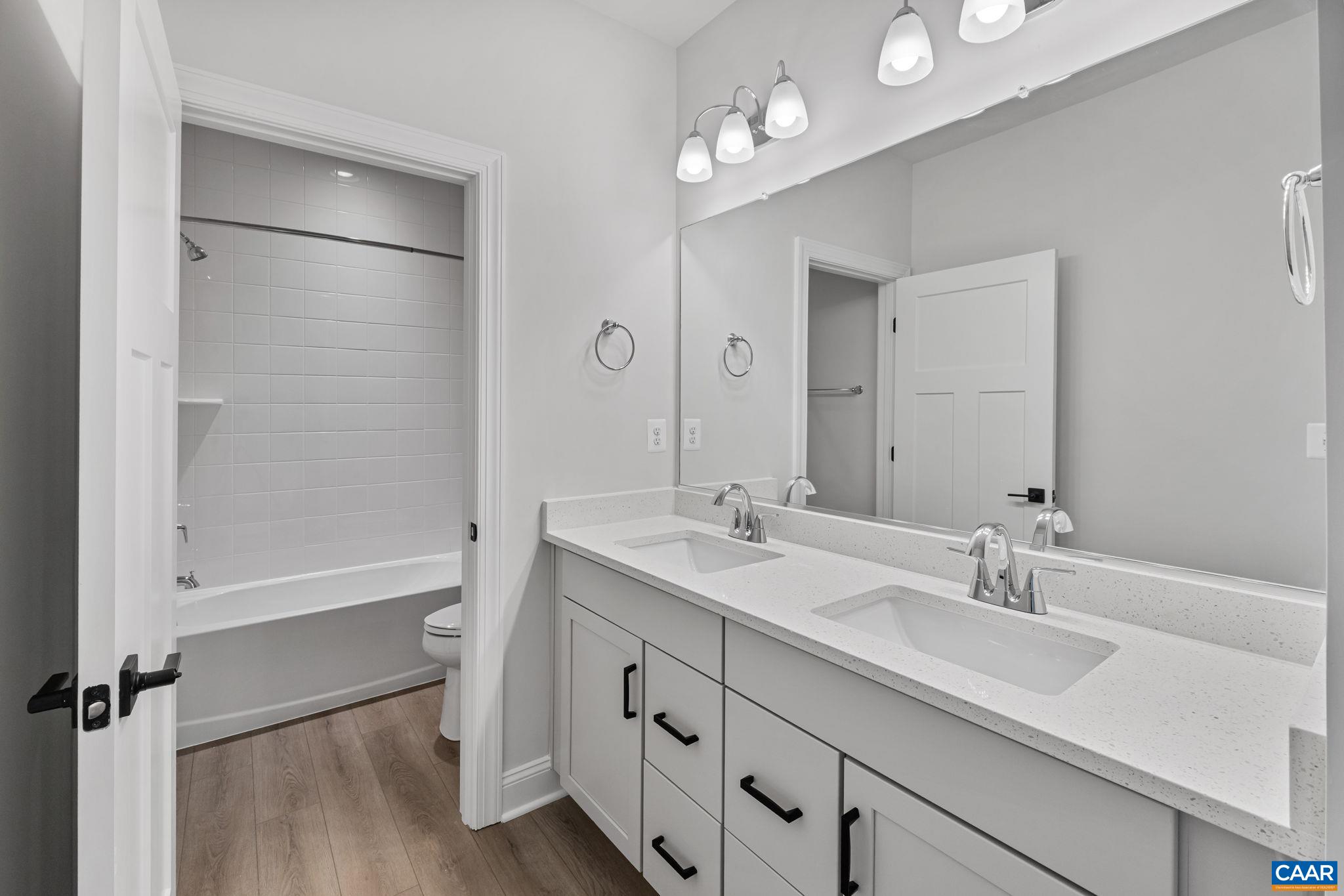 200 Marcella Street Charlottesville, VA 22911 - Photo 35 of 57 a bathroom with a double vanity sink mirror and shower