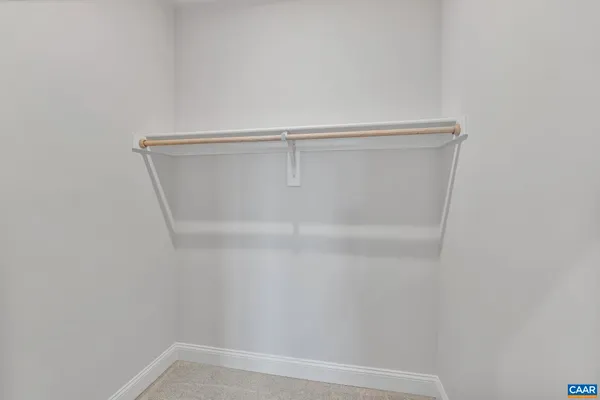 a bathroom with a sink toilet a mirror and shower