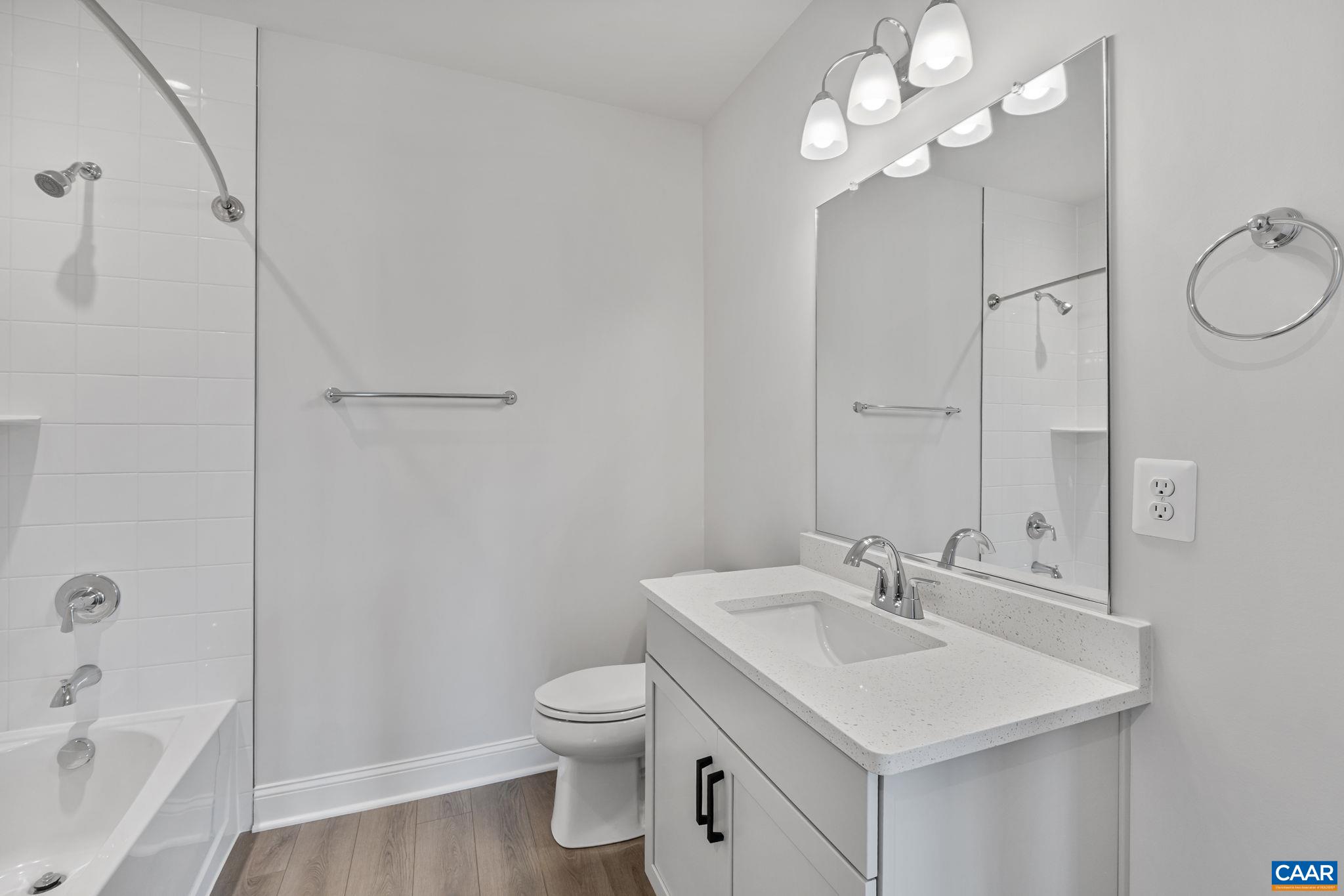 200 Marcella Street Charlottesville, VA 22911 - Photo 42 of 57 a bathroom with a sink toilet a mirror and shower