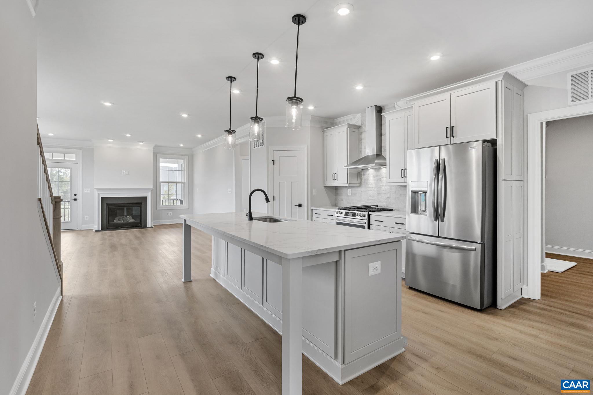 200 Marcella Street Charlottesville, VA 22911 - Photo 6 of 57 a kitchen with stainless steel appliances kitchen island a refrigerator a stove a sink and a oven