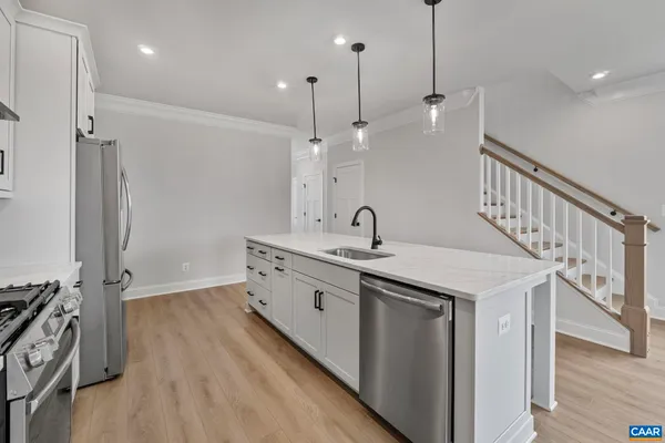 a view of a kitchen with wooden floor